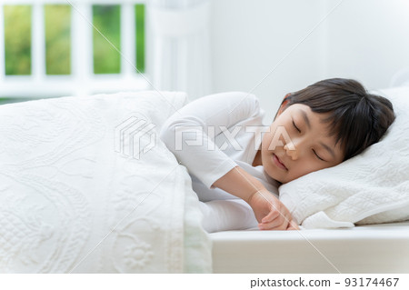 girl taking a nap in the bedroom 93174467