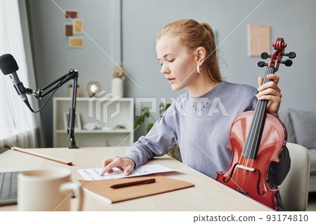 Woman Playing Violin in Home Studio Woman Playing Violin in Home Studio 93174810