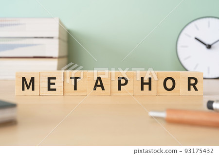 Image of metaphors and metaphors | Desk with a block written "METAPHOR" 93175432