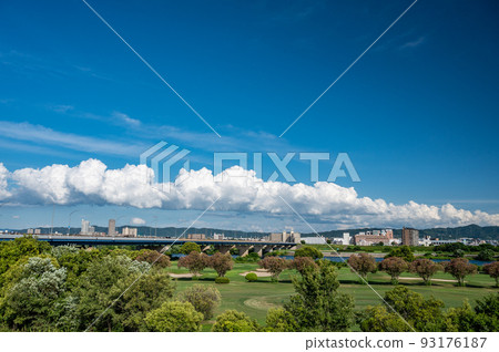 Riverbed golf course and Yodogawa Shinbashi, view of Neyagawa city 93176187