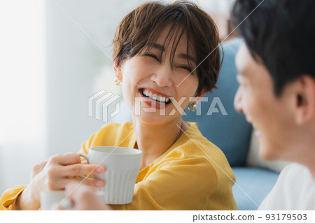 A couple in the living room 93179503