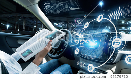 A woman riding in an automatic driving car A woman riding in an automatic driving car 93179710