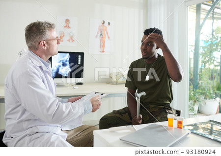 Soldier Suffering from Severe Headaches 93180924