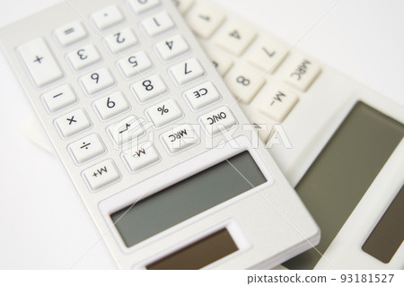 Expense image A close-up of two calculators on a white background Expense image A close-up of two calculators on a white background 93181527