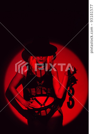 sexy slave girl in underwear and hat holds handcuffs in hands. Concept of BDSM submissive woman 93181577