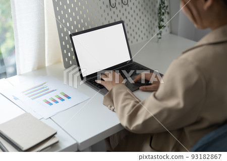 Young man working on his laptop with blank copy space screen for your advertising text message in office, Back view of business man hands busy using laptop at office desk 93182867