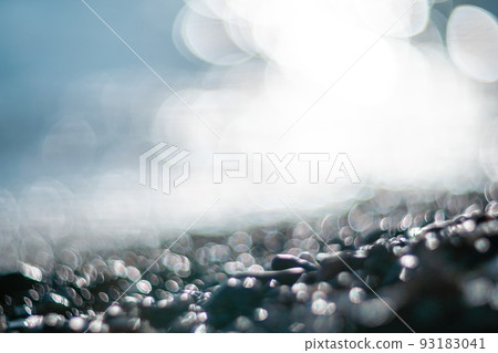 Abstract nature summer ocean sunset sea background. Small waves on water surface in motion blur with bokeh lights from sunrise. Holiday, vacation and recreational background concept. Abstract nature summer ocean sunset sea background. Small waves on water surface in motion blur with bokeh lights from sunrise. Holiday, vacation and recreational background concept. 93183041