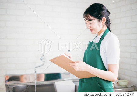 Female checking the water supply (faucet) Female checking the water supply (faucet) 93184277
