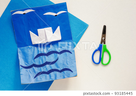 Paper craft card with ship sea and seagulls and scissors 93185445