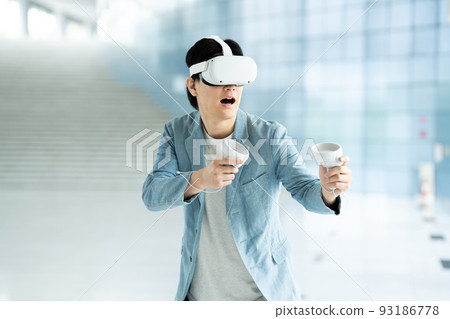 A man experiencing virtual reality in VR 93186778