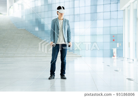 A man experiencing virtual reality in VR 93186806