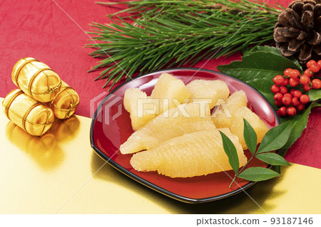New Year dishes 9 _ Kazunoko in a red plate _ Background red and gold and New Year decorations 93187146