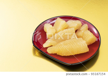 New Year dishes 9 _ red plate herring roe _ background gold 93187154