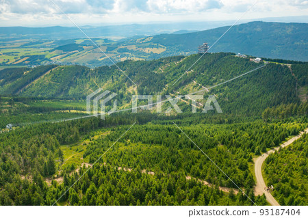 Aerial view of the worlds longest 721 meter suspension footbridge Sky bridge and observation tower the Sky walk in the forest, between mountains, Dolni Morava Ski Resort, Czech Republic. Aerial view of the worlds longest 721 meter suspension footbridge Sky bridge and observation tower the Sky walk in the forest, between mountains, Dolni Morava Ski Resort, Czech Republic. 93187404