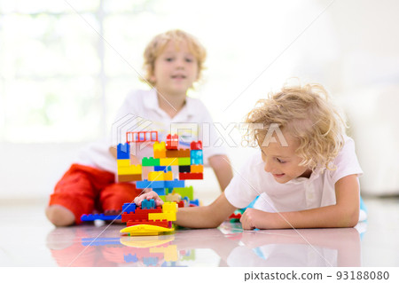 Child playing with toy blocks. Kids play. Child playing with toy blocks. Kids play. 93188080