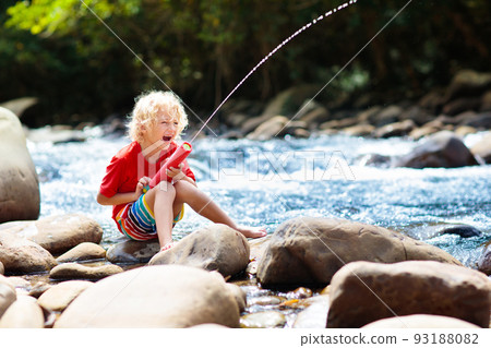 Child hiking in mountains. Kids at river shore. Child hiking in mountains. Kids at river shore. 93188082
