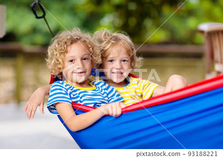 Boy in hammock. Kids play in summer garden. Boy in hammock. Kids play in summer garden. 93188221