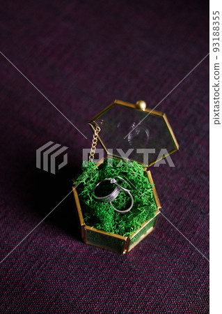 Close-up of wedding rings on a beautiful stand 93188355