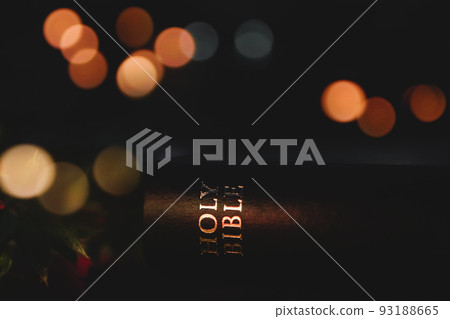 Christmas bright light background with bible and crucifixion of Jesus Christ and lights bokeh 93188665