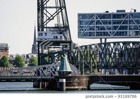 Cityscape of Rotterdam. Old steel bridge in Netherlands 93189786