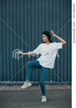 Asian young woman doing qigong exercise summer outdoor. 93190484