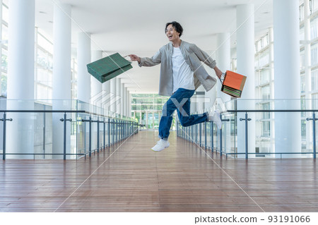 Young man shopping at the mall 93191066