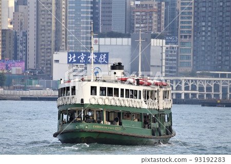Star ferry sailing through Victoria Bay in Hong Kong 93192283