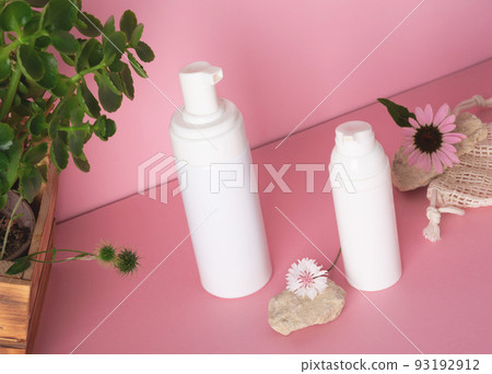 White bottle with a cosmetic products and flowers with natural materials 93192912