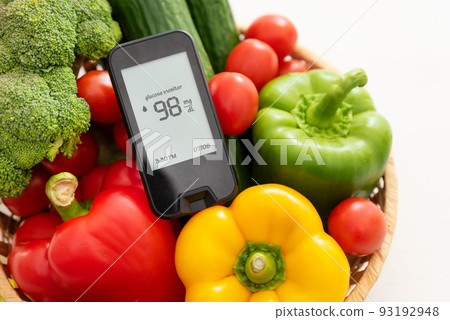 Glucometer with fresh vegetables. Diabetes concept 93192948