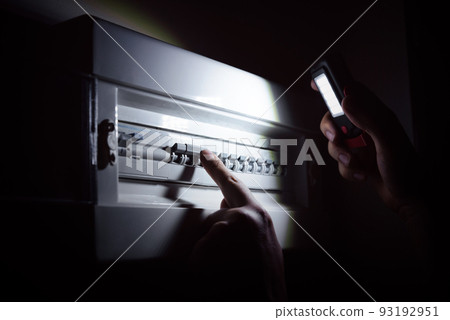 Blackout concept. Investigate a home fuse box. Blackout concept. Investigate a home fuse box. 93192951