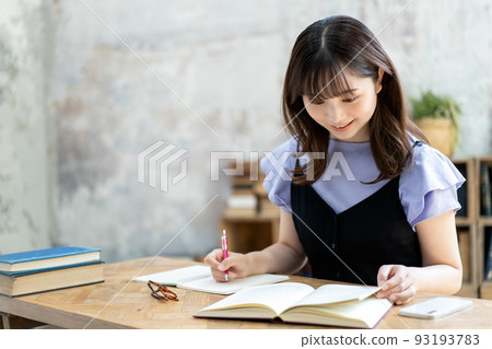 A young woman studying 93193783