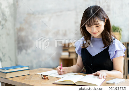 A young woman studying A young woman studying 93193785