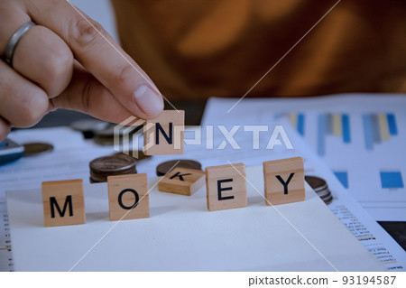 hand put word N for meaning of money. concept of money debt management. hand put word N for meaning of money. concept of money debt management. 93194587