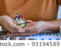 Two hand handle house model. concept of home loan. 93194589