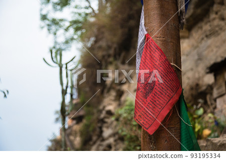 Tibetan buddhist prayer flag Thalcho on a tree Tibetan buddhist prayer flag Thalcho on a tree 93195334