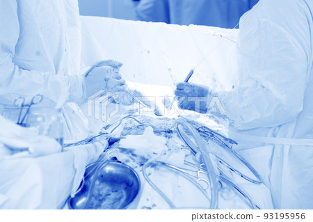 Surgeons perform an operation on a man.Medical background of the operating room. Surgeons perform an operation on a man.Medical background of the operating room. 93195956
