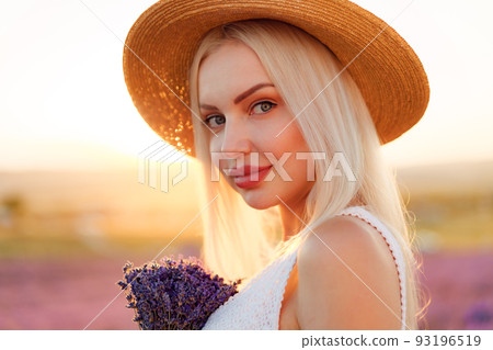 Blond haired girl standing in lavender field 93196519