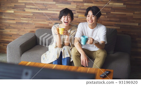 couple watching tv at home couple watching tv at home 93196920
