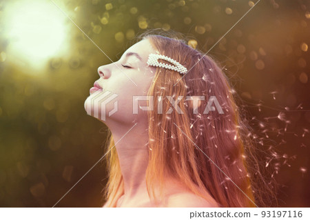 Beauty model girl profile with flying dandelions. Beautiful young woman with long romantic hair. Beauty model girl profile with flying dandelions. Beautiful young woman with long romantic hair. 93197116