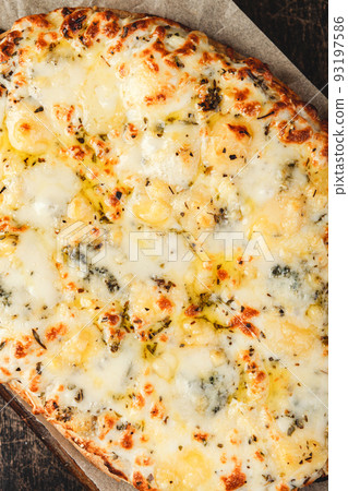 Roman-style pizzas with cheese. Roman square pizza or Pinsa on a thick dough, Italian Cuisine Roman-style pizzas with cheese. Roman square pizza or Pinsa on a thick dough, Italian Cuisine 93197586