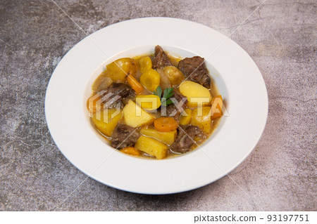 Recipe for beer and mustard beef chuck stew with potatoes, turnips and carrots 93197751