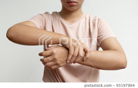 Woman hand massage physiotherapy wrist is sore and numb, exhausted, tingling. Guillain-Barre Syndrome, a side effect of the Covid vaccination 93197864
