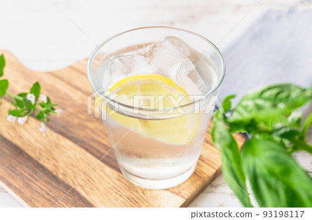 cold lemon water with ice 93198117