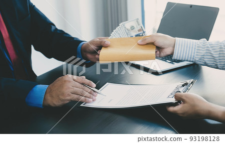 Government officials hand sign the contract and receiving bribe money from businessman, the concept of corruption and anti-bribery 93198128