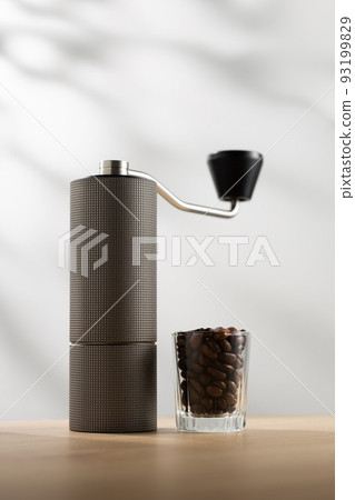 Manual coffee grinder and dark roast coffee beans Manual coffee grinder and dark roast coffee beans 93199829
