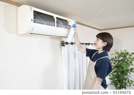 House cleaning woman cleaning the air conditioner 93199878