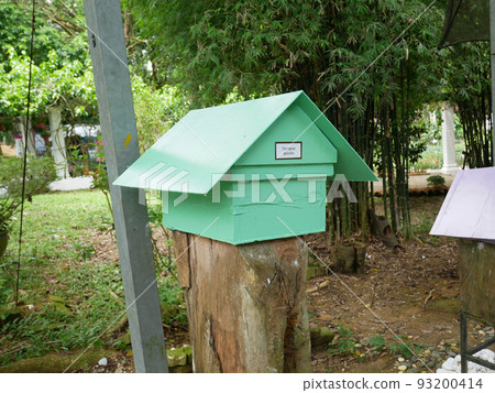 SERDANG, MALAYSIA -JUNE 7, 2022: Heterotrigona Itama or known as Stingless Bee. Man-made nests made of wood and colored colorfully to look attractive. it is farmed to get its honey. SERDANG, MALAYSIA -JUNE 7, 2022: Heterotrigona Itama or known as Stingless Bee. Man-made nests made of wood and colored colorfully to look attractive. it is farmed to get its honey. 93200414