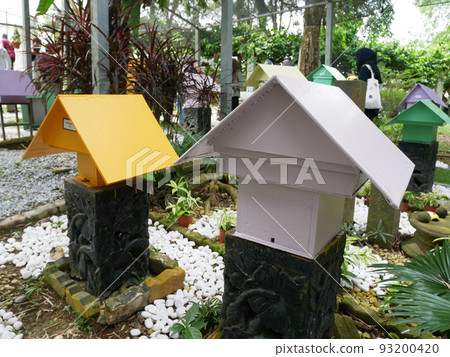 SERDANG, MALAYSIA -JUNE 7, 2022: Heterotrigona Itama or known as Stingless Bee. Man-made nests made of wood and colored colorfully to look attractive. it is farmed to get its honey. 93200420