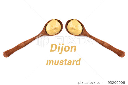 Two spoons with mustard on a white background between them the inscription Dijon mustard. Two spoons with mustard on a white background between them the inscription Dijon mustard. 93200906