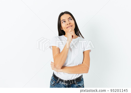 Happy dreaming young woman wearing white T-shirt 93201145